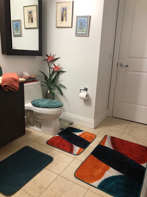 modern bathroom with turquoise toilet seat lid cover, bird of paradise art